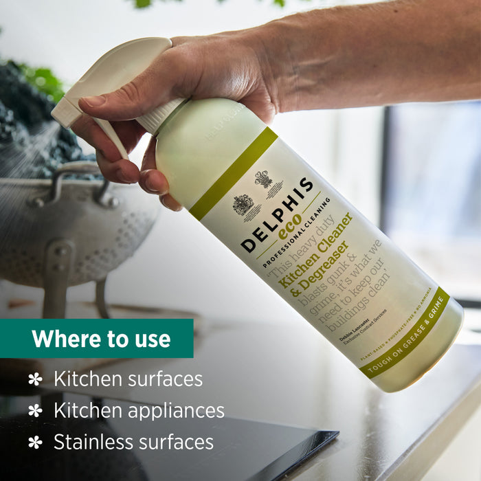 Bottle of Delphis Eco kitchen cleaner being held over a kitchen surface with text indicating where to use it.